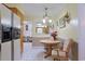 Cozy dining area featuring a round table, chairs, and elegant lighting fixtures at 412 43Rd Ave. N, Myrtle Beach, SC 29577