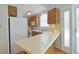 Functional kitchen featuring a white refrigerator, ample counter space and wood cabinets at 412 43Rd Ave. N, Myrtle Beach, SC 29577