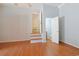 Bright living area with hardwood floors leading to bathroom and a separate room at 412 43Rd Ave. N, Myrtle Beach, SC 29577
