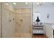 Luxurious shower with glass doors, decorative tile accents, and upscale fixtures at 412 43Rd Ave. N, Myrtle Beach, SC 29577