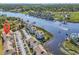 Aerial view of condos on the waterway with boat docks and golf course in the distance at 4430 Eastport Blvd. # L15, Little River, SC 29566