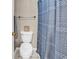 Bathroom featuring a toilet and a shower with blue patterned curtain and neutral walls at 4430 Eastport Blvd. # L15, Little River, SC 29566