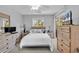 Bedroom featuring a bed with white linens and a window with natural light, plus dresser and nightstands at 4430 Eastport Blvd. # L15, Little River, SC 29566