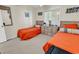 Cozy bedroom featuring two twin beds with bright orange bedding and a window with natural light at 4430 Eastport Blvd. # L15, Little River, SC 29566