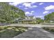 Large clubhouse with inviting curb appeal, manicured lawns and gardens at 4430 Eastport Blvd. # L15, Little River, SC 29566