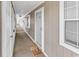Hallway with multiple doors leading to units, featuring carpeting and light-colored walls at 4430 Eastport Blvd. # L15, Little River, SC 29566
