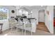 Updated kitchen featuring a convenient breakfast bar with seating, modern white cabinetry, and countertop space at 4430 Eastport Blvd. # L15, Little River, SC 29566