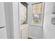 Convenient laundry area with stacked washer and dryer, plus a window providing natural light and ventilation at 4430 Eastport Blvd. # L15, Little River, SC 29566