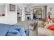 Cozy living room area with a sliding door to the outside and a view into the adjacent bedroom at 4430 Eastport Blvd. # L15, Little River, SC 29566