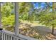 View from a screened porch to the open green space and trees beyond at 4430 Eastport Blvd. # L15, Little River, SC 29566