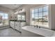 Bright bathroom featuring tile floors, double vanity, granite countertops, a soaking tub, and large windows at 468 Saint Julian Ln., Myrtle Beach, SC 29579