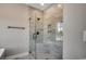 Modern bathroom showcasing a glass-enclosed shower with marble tiling, a built-in bench, and matte black hardware at 468 Saint Julian Ln., Myrtle Beach, SC 29579