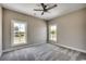 Bedroom with neutral carpeting, ceiling fan and two windows provide ample natural light at 468 Saint Julian Ln., Myrtle Beach, SC 29579