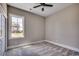 Bedroom featuring neutral carpeting, base molding, updated ceiling fan and a large window at 468 Saint Julian Ln., Myrtle Beach, SC 29579