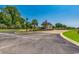 A view of the manicured community entrance with brick accents and palm trees at 468 Saint Julian Ln., Myrtle Beach, SC 29579