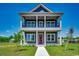 Charming two-story home featuring a double porch, stylish columns, and a beautifully landscaped front yard at 468 Saint Julian Ln., Myrtle Beach, SC 29579