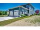 Exterior view of a two car garage with white doors, and green siding at 468 Saint Julian Ln., Myrtle Beach, SC 29579
