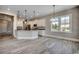 Modern kitchen with stainless steel appliances, granite countertops, and contemporary lighting at 468 Saint Julian Ln., Myrtle Beach, SC 29579