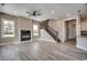 Contemporary living space features sleek floors, a modern fireplace, and a staircase leading to the upper level at 468 Saint Julian Ln., Myrtle Beach, SC 29579