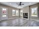 Bright and airy living room boasts a modern fireplace, recessed lighting, and several large windows at 468 Saint Julian Ln., Myrtle Beach, SC 29579