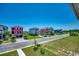 Street view of colorful, multi-story homes boasting manicured lawns, private garages, and professionally maintained landscaping at 468 Saint Julian Ln., Myrtle Beach, SC 29579