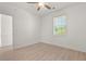 Bright bedroom with hardwood floors, ceiling fan, and ample natural light at 4683 Wild Iris Dr. # 204, Myrtle Beach, SC 29577