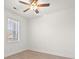 Bright bedroom with hardwood floors, ceiling fan, and ample natural light at 4683 Wild Iris Dr. # 204, Myrtle Beach, SC 29577