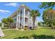 Beautiful exterior of a building with stone accents, private balconies, and lush landscaping at 4683 Wild Iris Dr. # 204, Myrtle Beach, SC 29577
