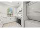 Bright modern white kitchen with granite countertops, stainless steel appliances, and subway tile backsplash at 4683 Wild Iris Dr. # 204, Myrtle Beach, SC 29577