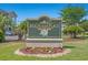 Magnolia Place sign surrounded by beautiful flowers and greenery at 4683 Wild Iris Dr. # 204, Myrtle Beach, SC 29577