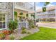 Back patio with a view of exterior balconies and landscaped grounds and parking at 4787 Wild Iris Dr. # 101, Myrtle Beach, SC 29577