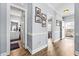 Hallway featuring hardwood floors, neutral paint, and doorways leading to various rooms of the home at 4787 Wild Iris Dr. # 101, Myrtle Beach, SC 29577