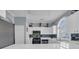 Bright kitchen featuring white cabinets, stainless steel appliances, tile backsplash, and a large arched window at 4787 Wild Iris Dr. # 101, Myrtle Beach, SC 29577