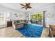 Cozy living room featuring a comfortable sectional sofa, a ceiling fan, and a sliding door to the patio at 4787 Wild Iris Dr. # 101, Myrtle Beach, SC 29577