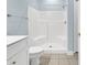 Bathroom featuring a white vanity, tile flooring, and a white shower/tub combo at 4878 Dahlia Ct. # 104, Myrtle Beach, SC 29577