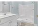 Bright bathroom featuring a white vanity and a white shower and tub combo at 4878 Dahlia Ct. # 104, Myrtle Beach, SC 29577