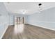 Light-filled living room with wood floors and sliding glass doors to the outside at 4878 Dahlia Ct. # 104, Myrtle Beach, SC 29577