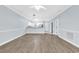 Bright living room featuring open floor plan, light blue walls, and hardwood floors at 4878 Dahlia Ct. # 104, Myrtle Beach, SC 29577