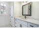 Bathroom featuring marble-topped vanity with sleek black fixtures and hardware, offering a luxurious feel at 4932 South Island Dr., North Myrtle Beach, SC 29582