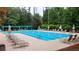 Large community pool with ample lounge chairs and shaded seating areas at 4932 South Island Dr., North Myrtle Beach, SC 29582