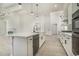 Modern kitchen with view of the dining area, stainless steel appliances and granite countertops at 4932 South Island Dr., North Myrtle Beach, SC 29582