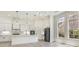 Bright open-concept kitchen with a large island, modern lighting and stainless appliances at 4932 South Island Dr., North Myrtle Beach, SC 29582