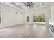 Bright living room with coffered ceilings, large windows, and sliding doors to the outdoor space at 4932 South Island Dr., North Myrtle Beach, SC 29582