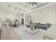 Open-concept living space with coffered ceilings flows into a modern kitchen with stainless steel appliances at 4932 South Island Dr., North Myrtle Beach, SC 29582