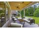Covered patio area with comfortable seating and an outdoor kitchen perfect for entertaining at 4932 South Island Dr., North Myrtle Beach, SC 29582