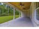 Covered patio area with brick columns and a view of the wooded backyard at 4932 South Island Dr., North Myrtle Beach, SC 29582