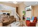Open-concept living room with hardwood floors, vaulted ceiling, and staircase at 503 20Th Ave. N # 19-C, North Myrtle Beach, SC 29582