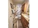 Cozy bathroom features a vanity with granite countertop and a shower with nautical-themed curtain at 503 20Th Ave. N # 3B, North Myrtle Beach, SC 29582