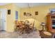 Traditional dining area with a round wooden table and view to the front door at 510 Fairwood Lakes Dr. # 16-I, Myrtle Beach, SC 29588