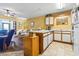 Kitchen featuring white cabinets and open to living room at 510 Fairwood Lakes Dr. # 16-I, Myrtle Beach, SC 29588